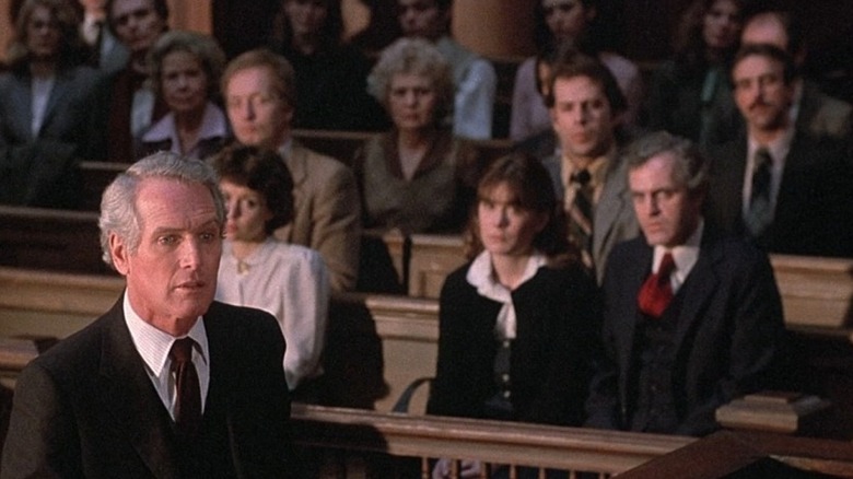 A crowd of onlookers watch court proceedings from their benches