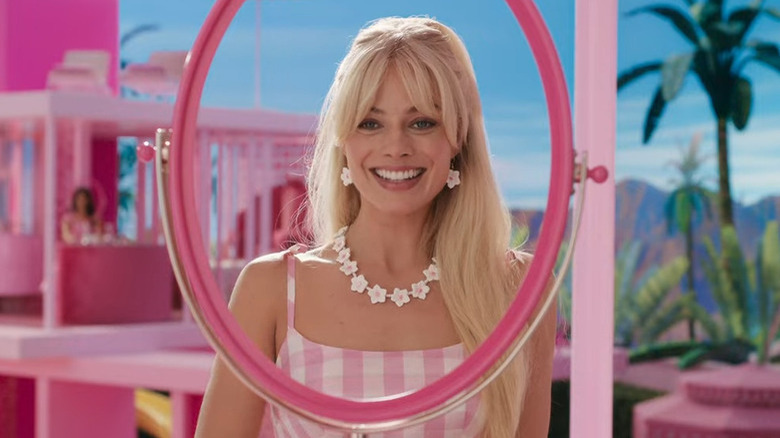 Barbie smiling in the mirror