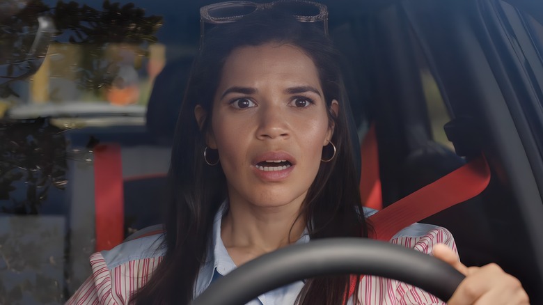 Gloria driving looking shocked