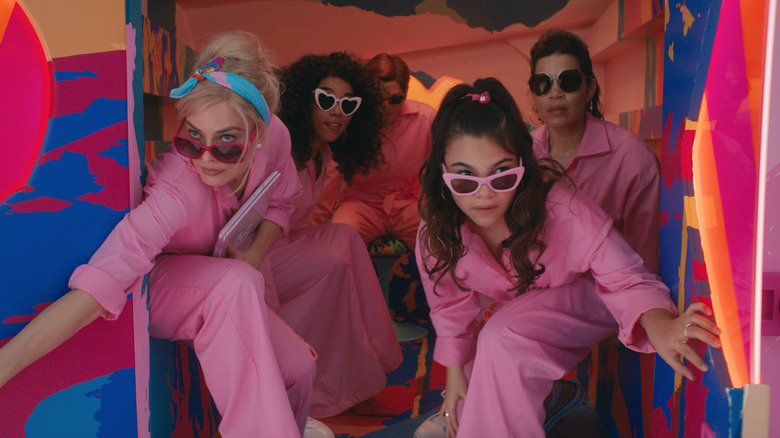 Barbie and friends in pink jumpsuits and sunglasses