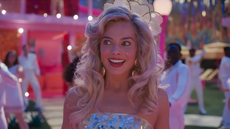 Barbie smiling at a party at her Barbie Dreamhouse