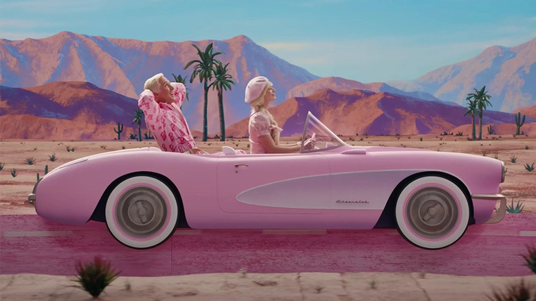 Barbie and Ken driving in car