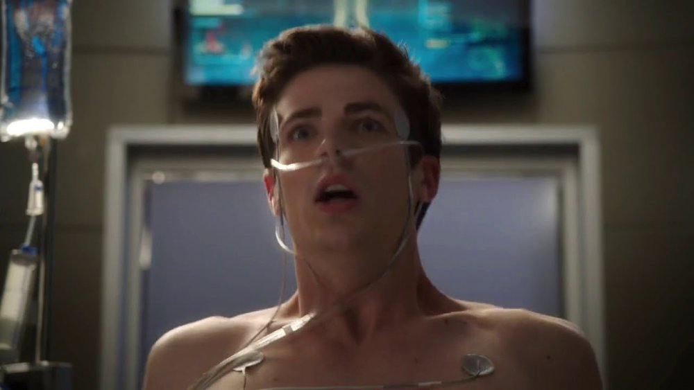 Grant Gustin as Barry Allen waking up from a coma in the Flash