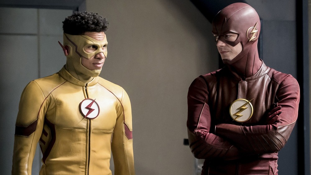 Kid Flash and Flash smirk at each other