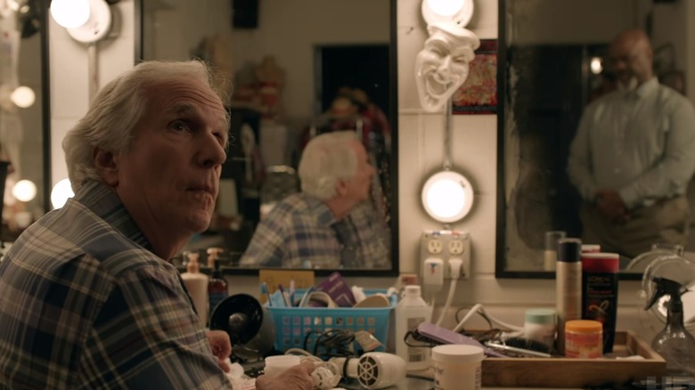 Gene Cousineau sitting in a dressing room talking to Jim