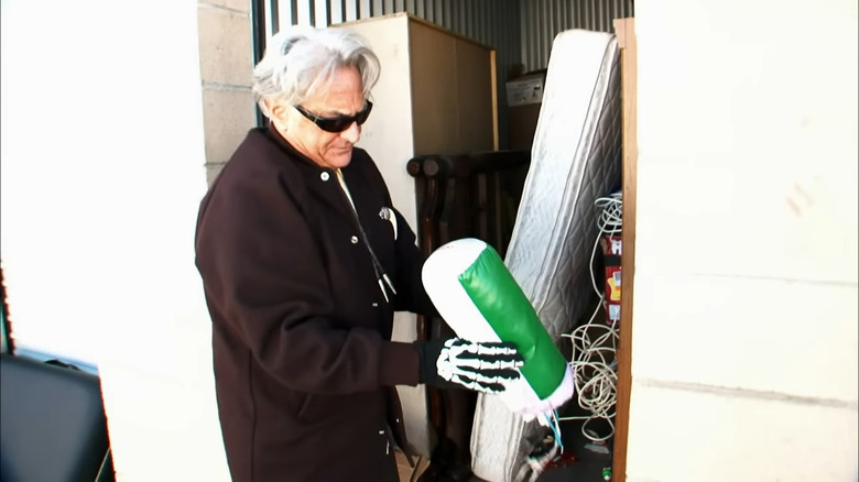 Barry Weiss rummaging through items