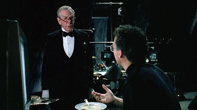 Batman and Alfred talking in the Batcave