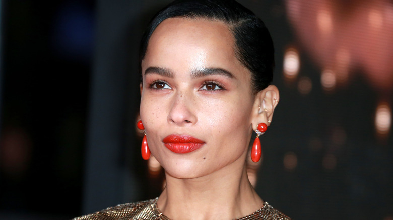 Zoë Kravitz red lips and earrings