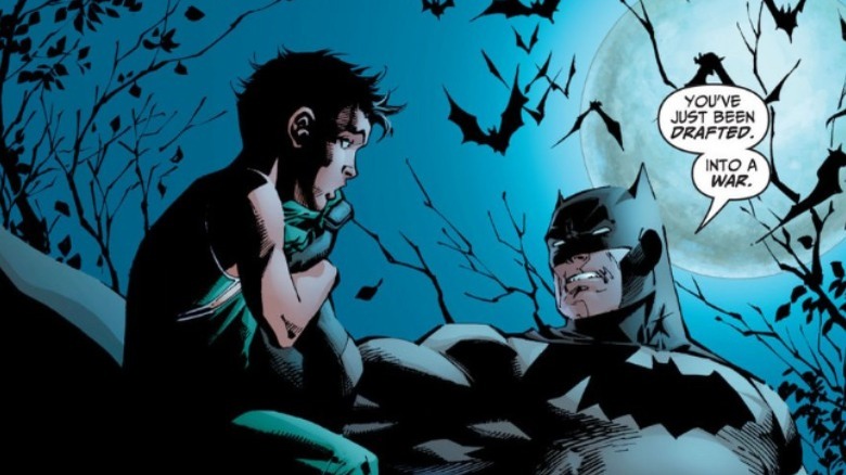 Batman grabbing Dick Grayson after his family is killed