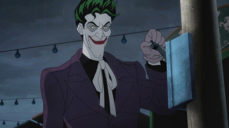 Joker preparing to pull a lever