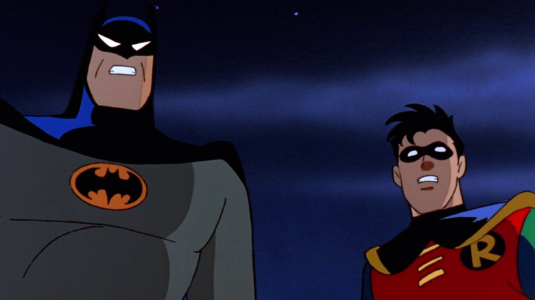 Batman and Robin look on in surprise