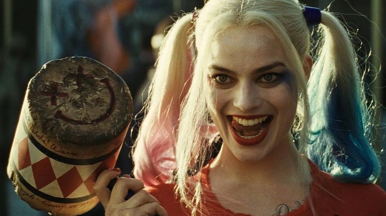 Harley Quinn holding mallet and smiling