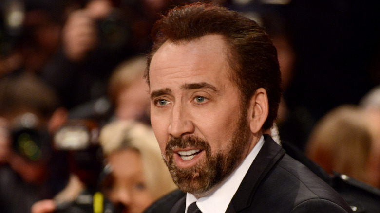 Nicolas Cage smiling and talking