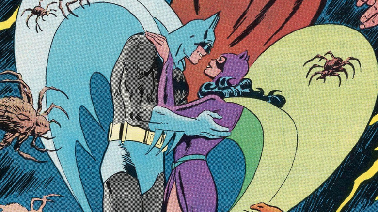 Batman and Catwoman embracing