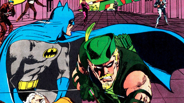 Batman and Green arrow facing thugs