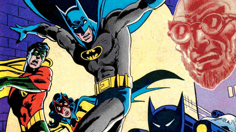 Batman, Robin and Batwoman in alley