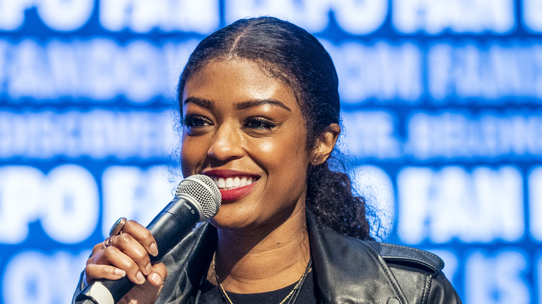 Javicia Leslie speaking at a fan event