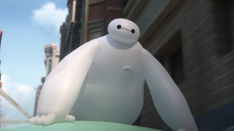 Baymax riding on top of a car