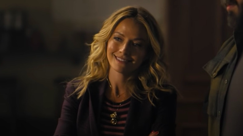 Lorna smiling in "The Lincoln Lawyer" screenshot