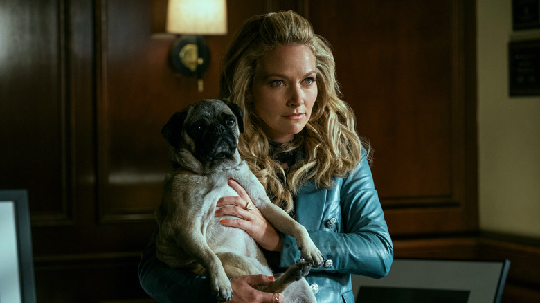 Lorna holding her pug dog