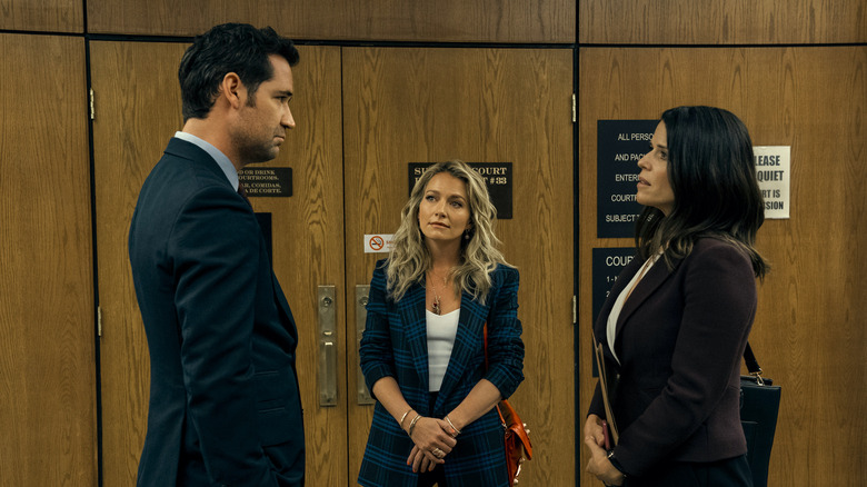 Mickey, Lorna, and Maggie talking outside courtroom