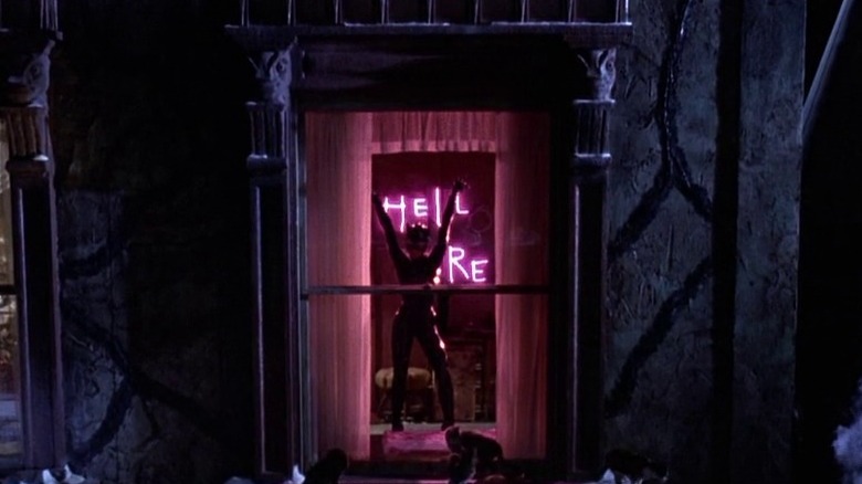 Catwoman in front of Hell Here sign