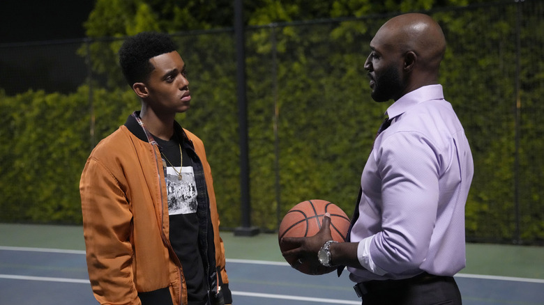 Will and Uncle Phil talk on the basketball court