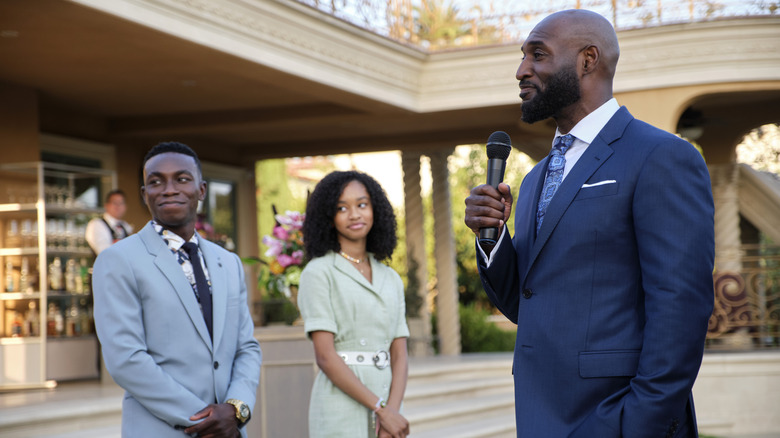 Uncle Phil, Carlton, and Ashley smiling at an event in Bel-Air