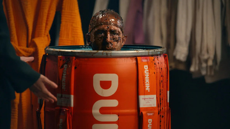 Jeremy Strong emerges from a vat of coffee in the Dunkin' Super Bowl ad