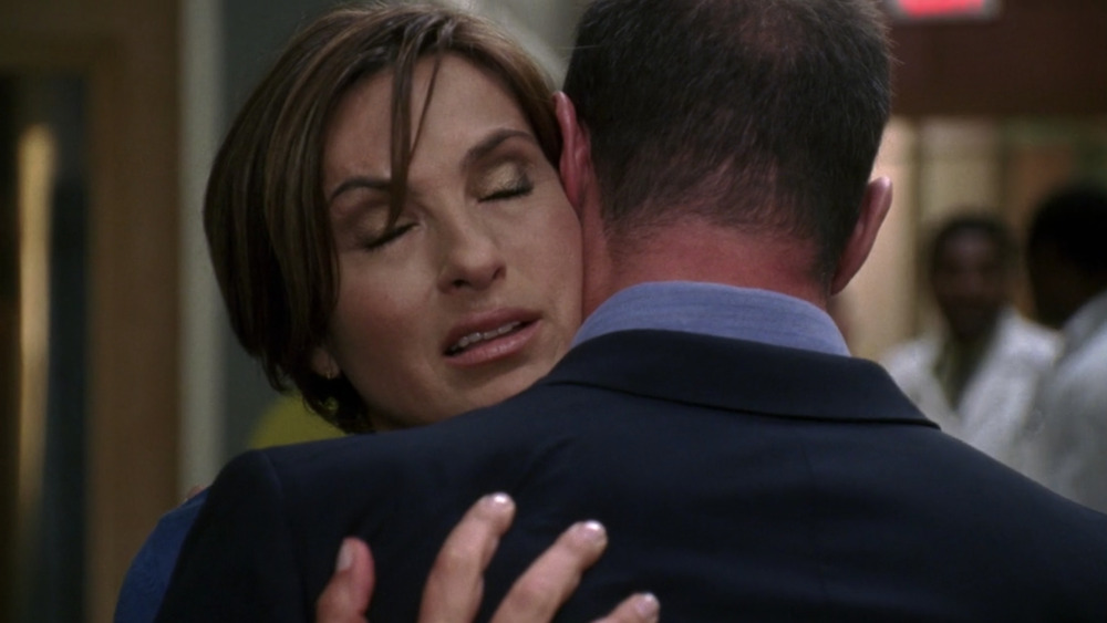 Elliot and Olivia hug