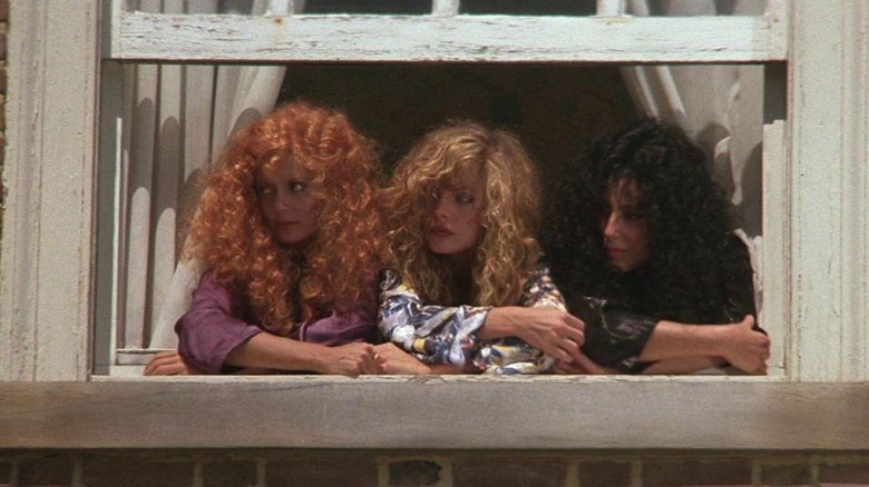 Michelle Pfeiffer, Susan Sarandon, and Cher at window