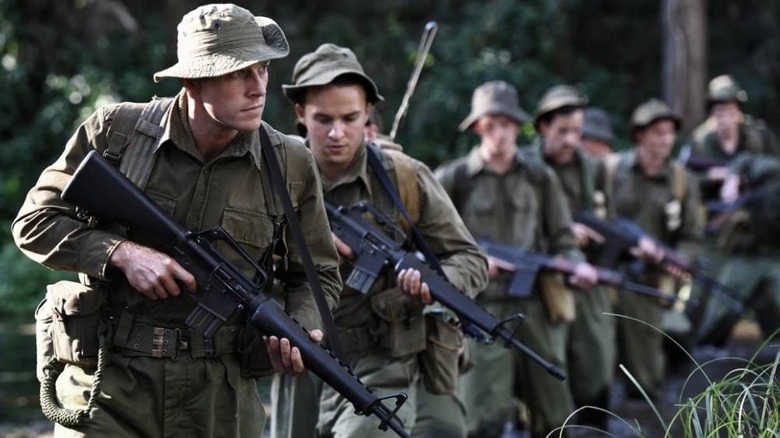 Soldiers walking in field