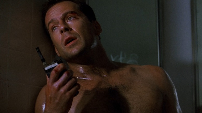 John McClane talking on walkie talkie