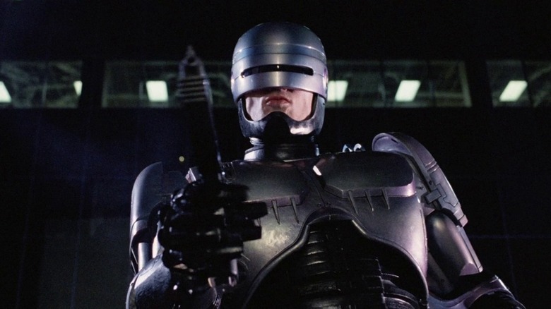 Robocop holds gun