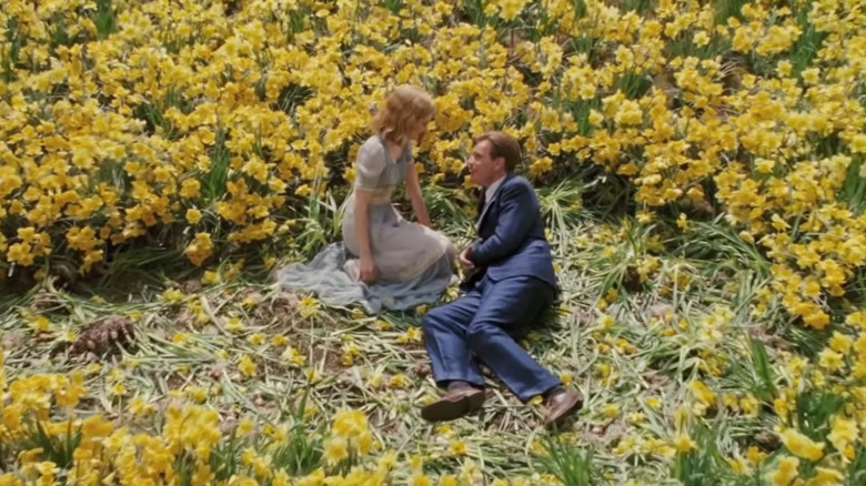 Edward and Sandra recline in the daffodils