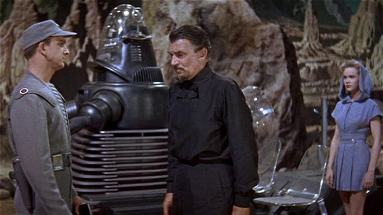 Robby the Robot speaks to Morbius and Adams