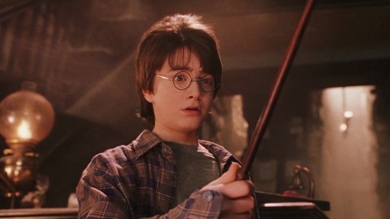 Harry holds wand