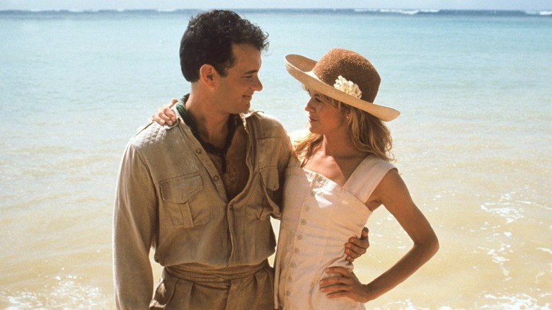 Joe and Patricia hugging on beach