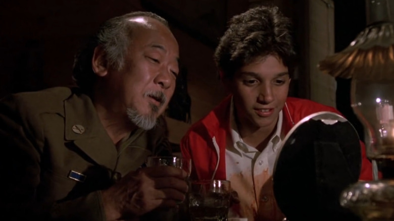 Pat Morita and Ralph Macchio talking