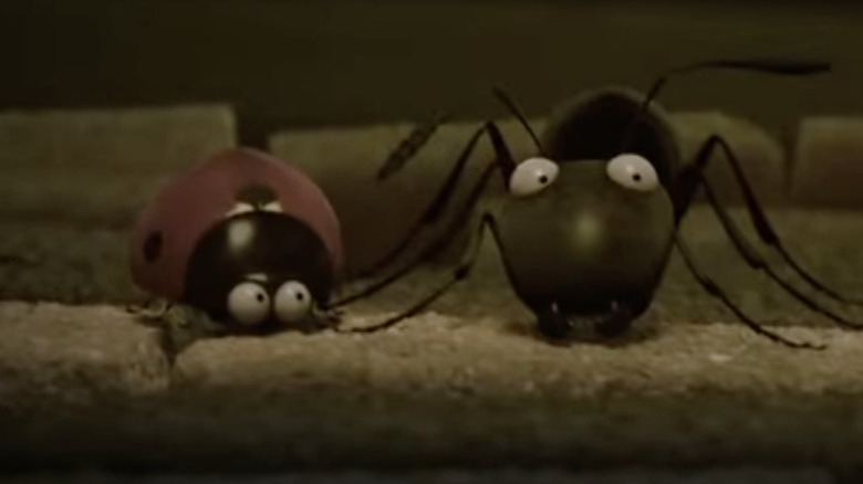 Cartoon ladybug and ant crouching