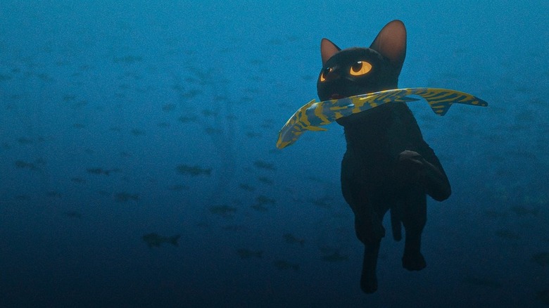 A cat swims underwater with a fish in its mouth in "Flow" (2024)