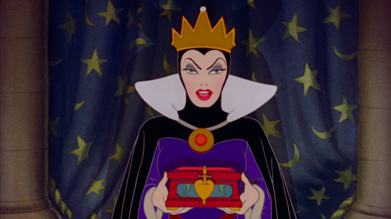 The Evil Queen holding a box for Snow White's heart