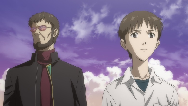 Shinji and Gendo Ikari outdoors