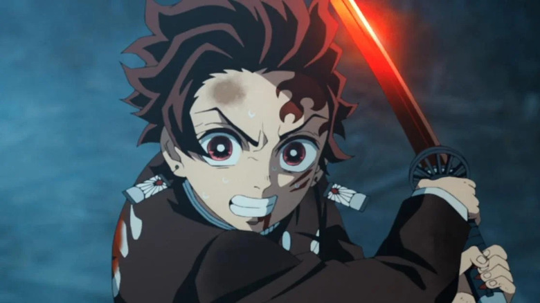 Tanjiro swings his sword