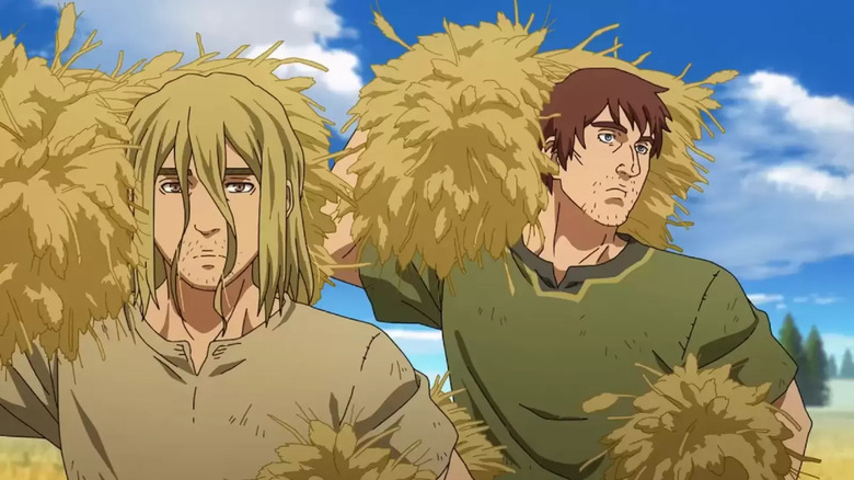 Thorfinn and Thorkell hold bails of hay