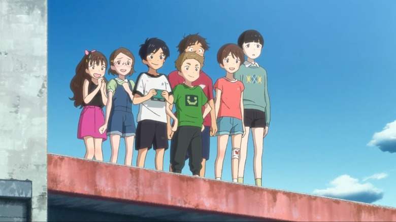 Kosuke, Natsume, and their friends looking at the sea