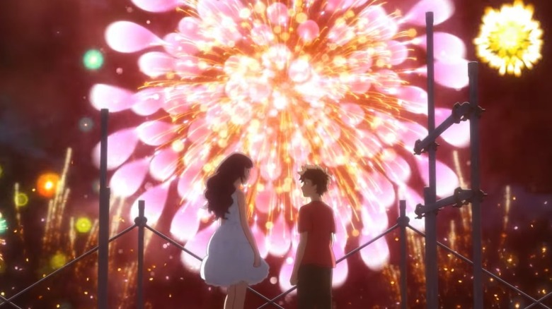 Nozuna and Norimichi look at each other in front of fireworks.