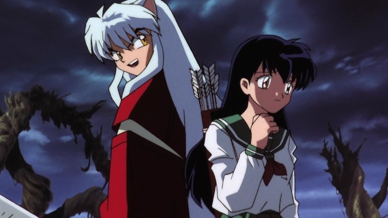 Inuyasha smirking while Kagome looks concerned