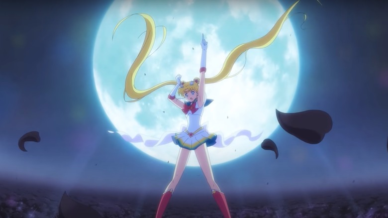 Super Sailor Moon posing in front of a full moon