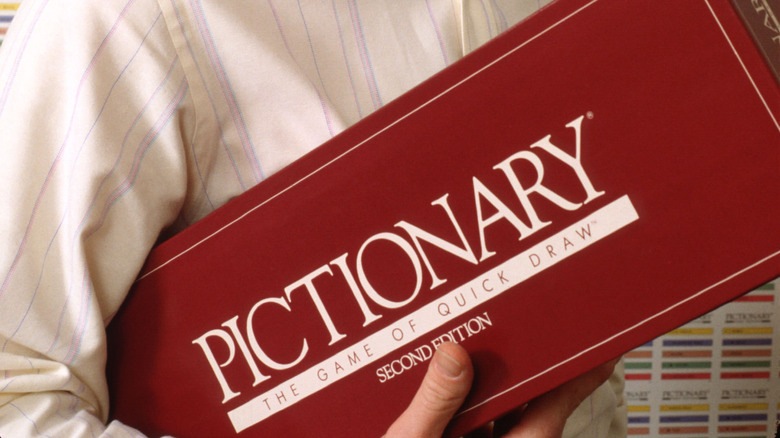 Pictionary box in hand